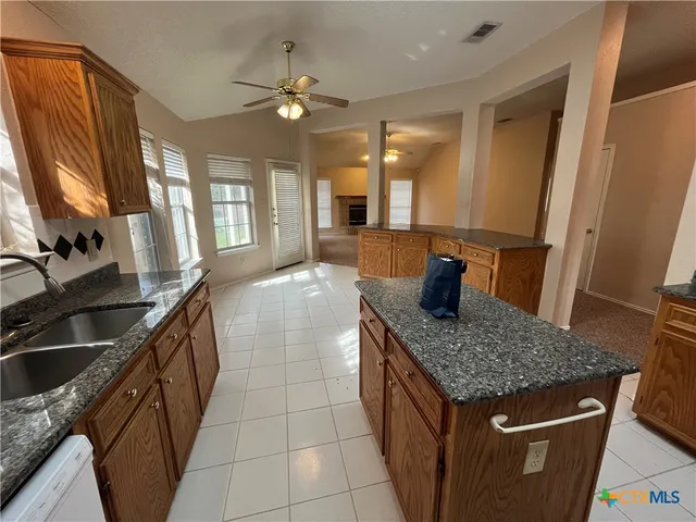 a view of a kitchen with furniture and chandelier