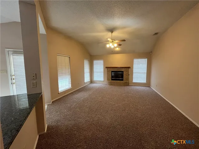 a bathroom with a sink and mirror with toilet
