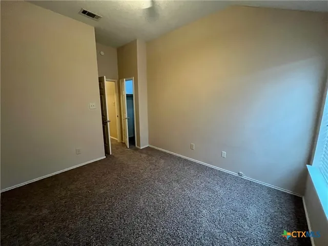 a bathroom with a toilet and a bathtub