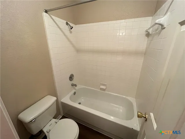 an empty room with a empty space and a window