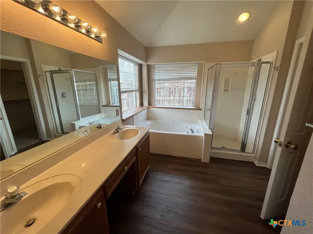 a bathroom with a bathtub and a shower