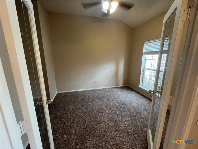 an empty room with a bathroom