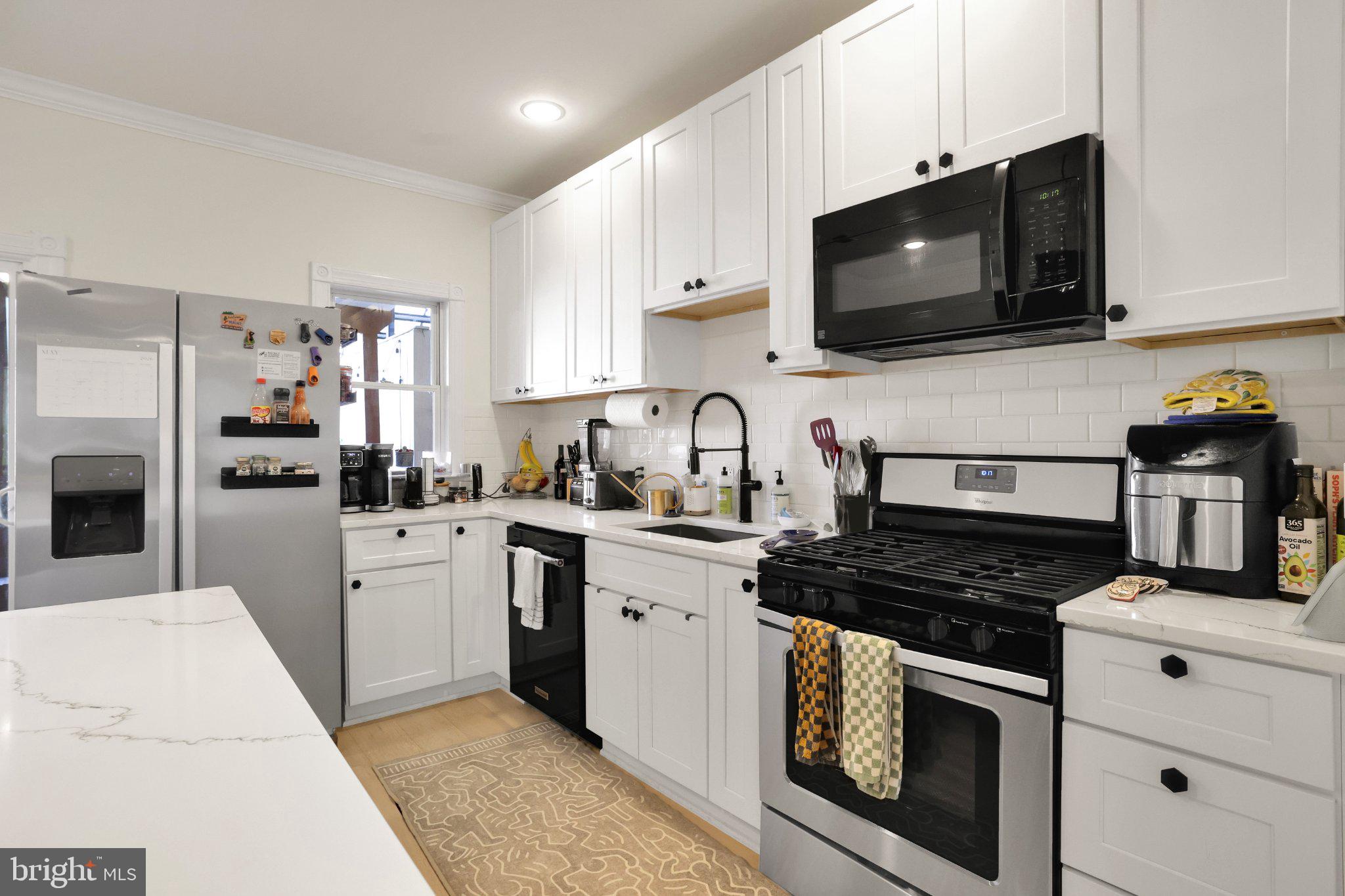 407 O Street Northwest Washington, DC 20001 - Photo 18 of 47 Modern kitchen with sleek finishes.