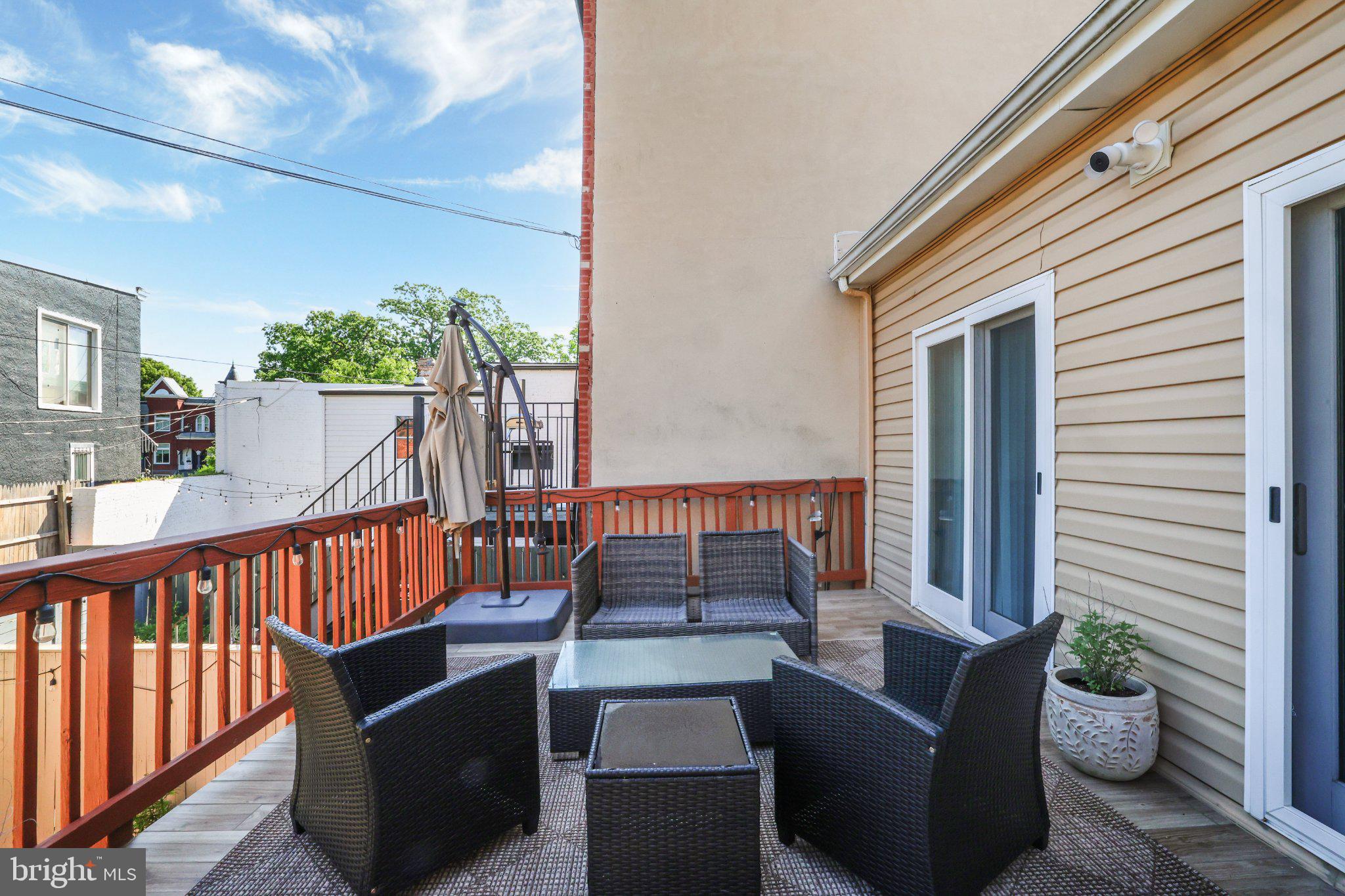 407 O Street Northwest Washington, DC 20001 - Photo 42 of 47 Charming outdoor retreat with skyline views.