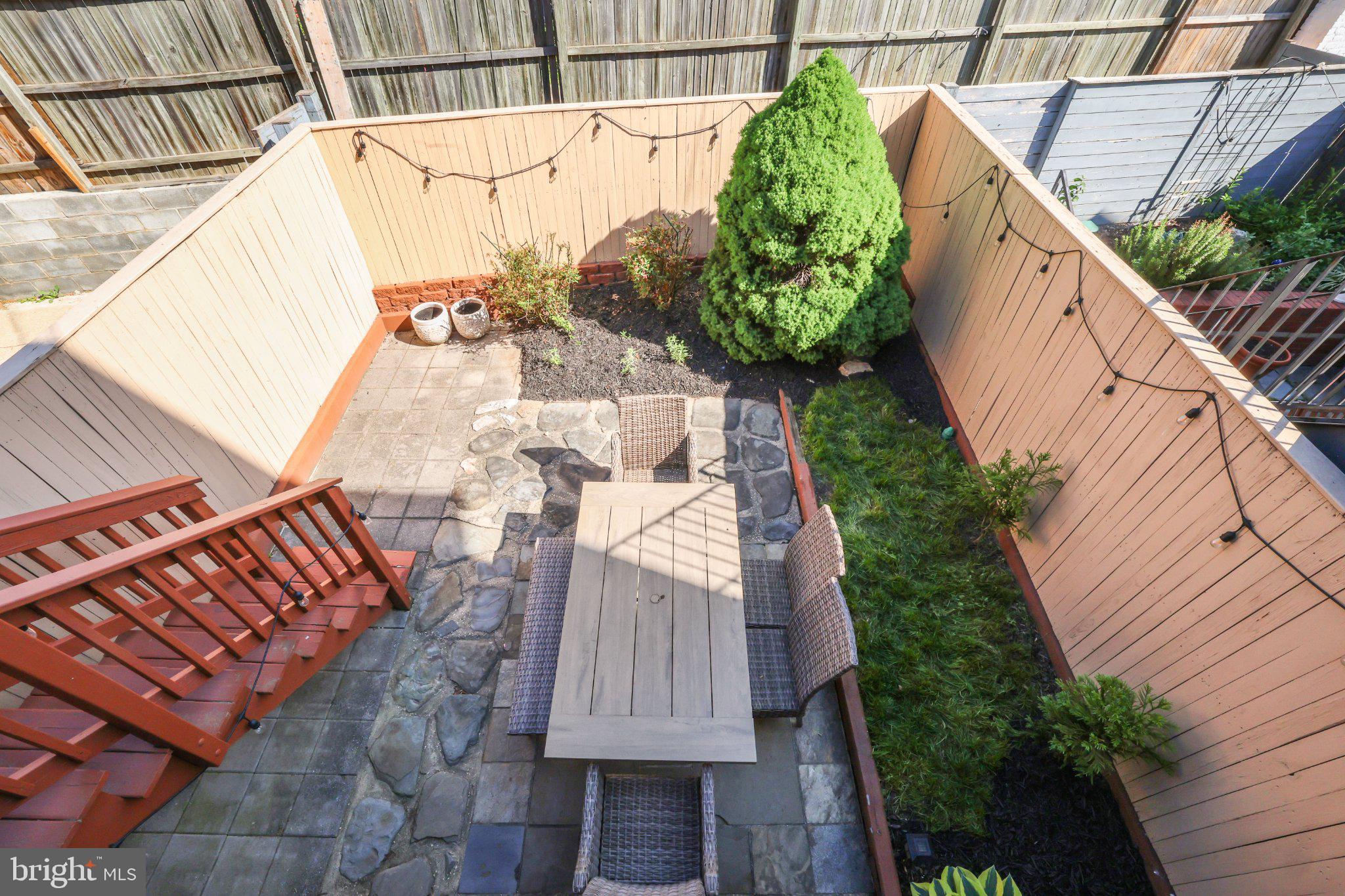 407 O Street Northwest Washington, DC 20001 - Photo 45 of 47 Charming outdoor retreat with greenery.