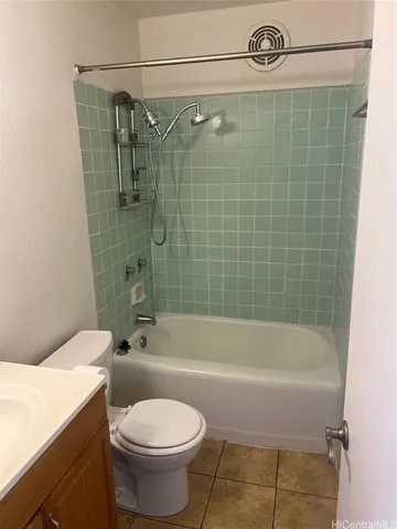 a bathroom with a toilet and a bathtub