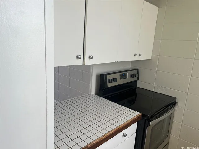 a kitchen with a stove and a microwave