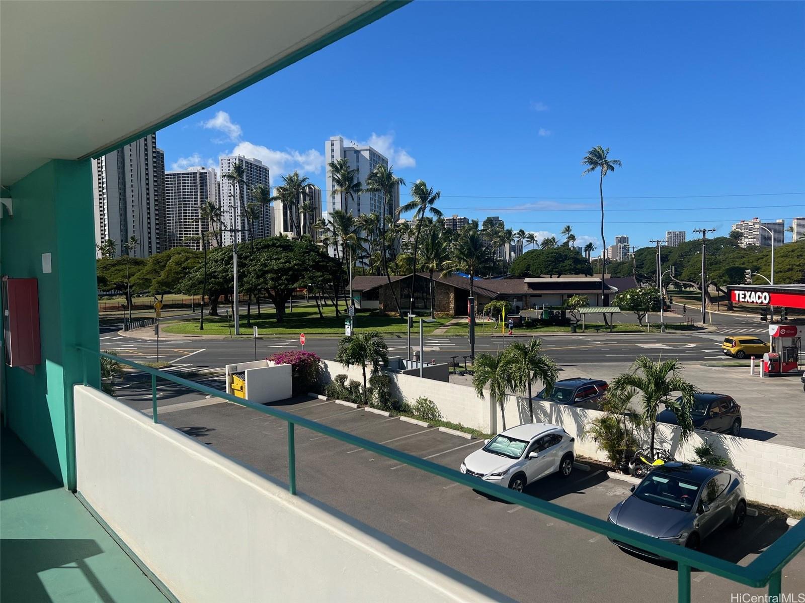 3410 Leahi Avenue, Unit 304 Honolulu, HI 96815 - Photo 22 of 25 a view of a swimming pool with outdoor seating and a floor to ceiling window