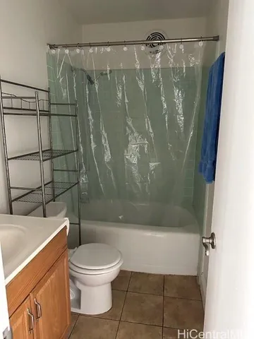 a bathroom with a shower and a toilet