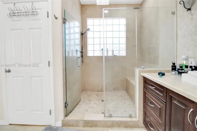 a white toilet sitting next to a white sink