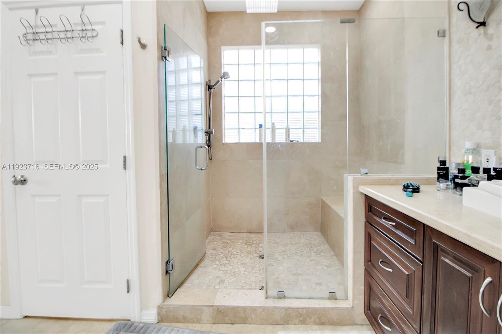 15875 Southwest 149th Lane Miami, FL 33196 - Photo 12 of 32 a bathroom with a sink and a shower