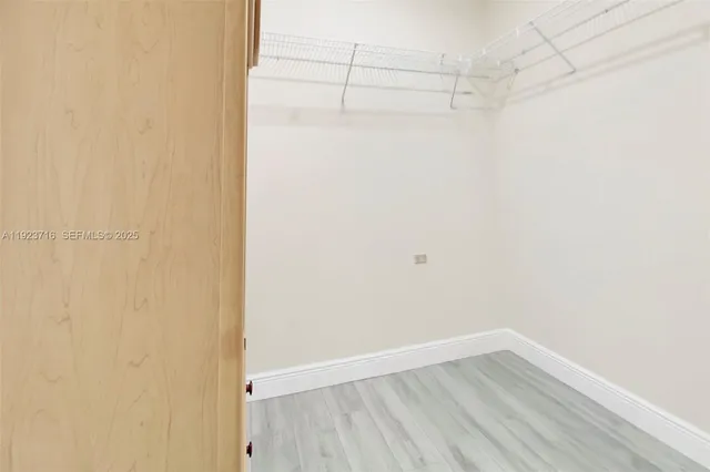 a white toilet sitting next to a shower curtain