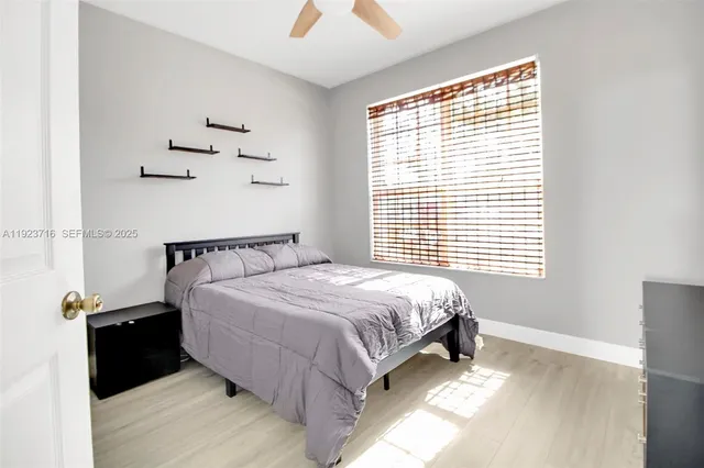 a bathroom with double sink and a mirror