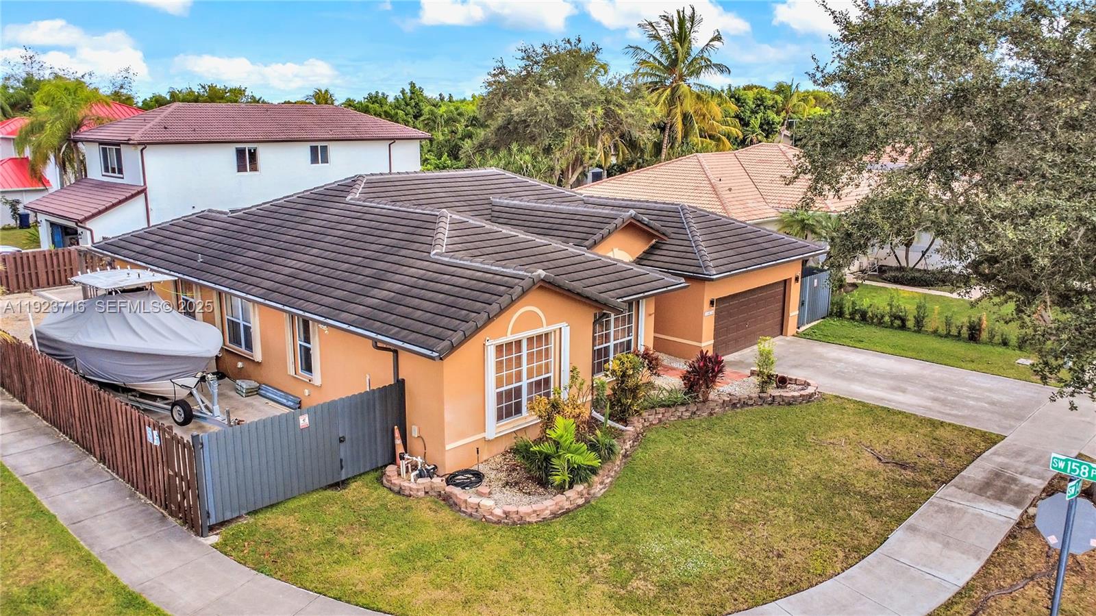 15875 Southwest 149th Lane Miami, FL 33196 - Photo 2 of 32 a view of a house with backyard and sitting area