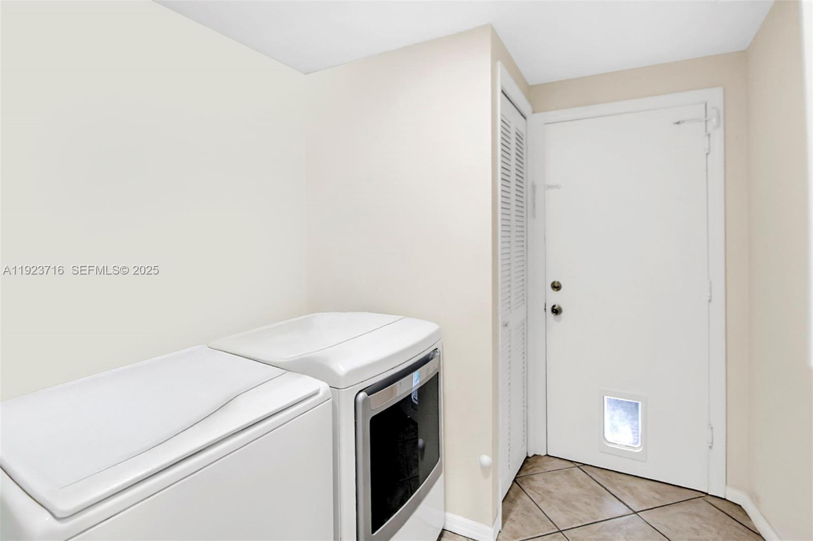 15875 Southwest 149th Lane Miami, FL 33196 - Photo 22 of 32 a utility room with dryer and washer