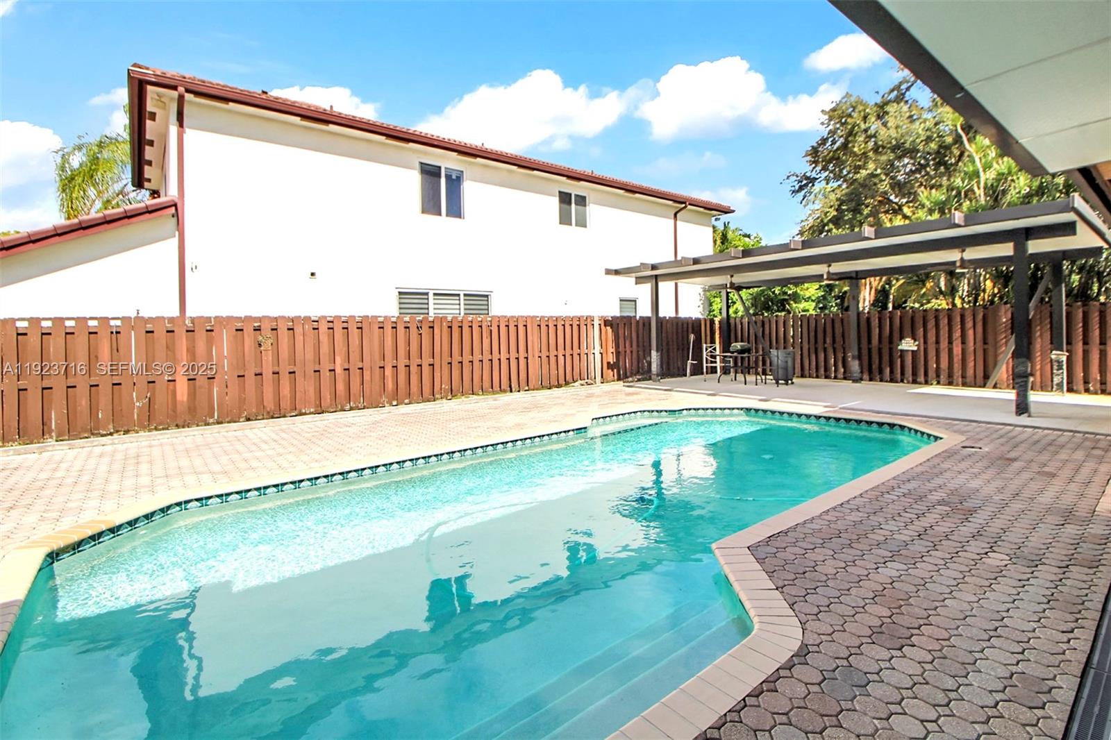 15875 Southwest 149th Lane Miami, FL 33196 - Photo 27 of 32 a view of swimming pool with a yard