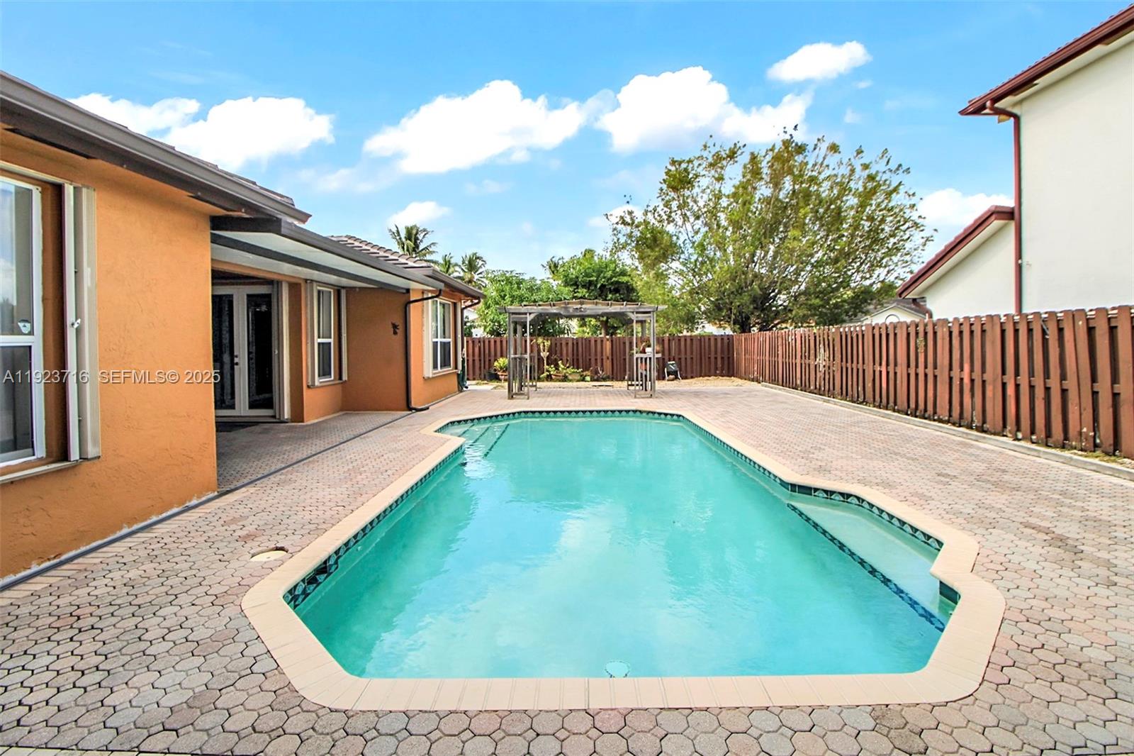 15875 Southwest 149th Lane Miami, FL 33196 - Photo 28 of 32 a view of a backyard with swimming pool