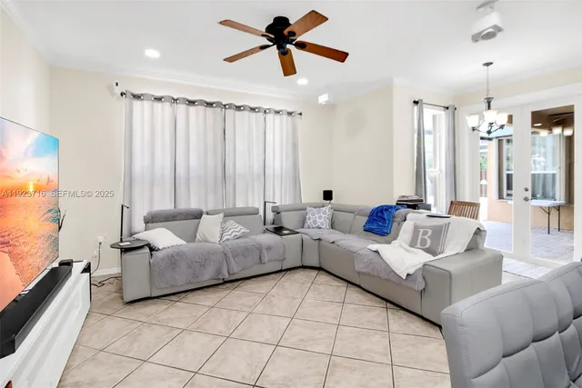 a living room with hard wood flooring and a couch