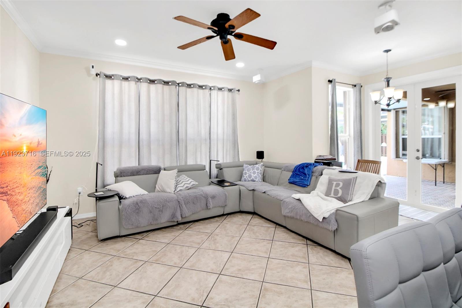 15875 Southwest 149th Lane Miami, FL 33196 - Photo 7 of 32 a living room with furniture and a large window