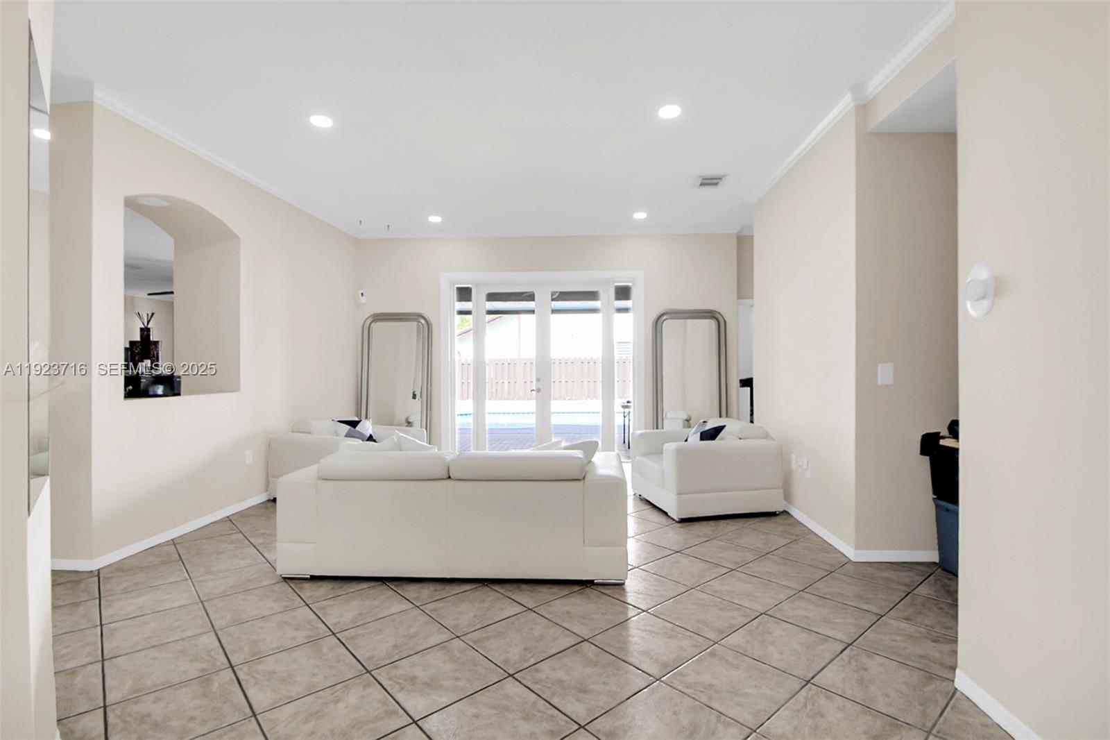 15875 Southwest 149th Lane Miami, FL 33196 - Photo 10 of 32 a living room with furniture and window