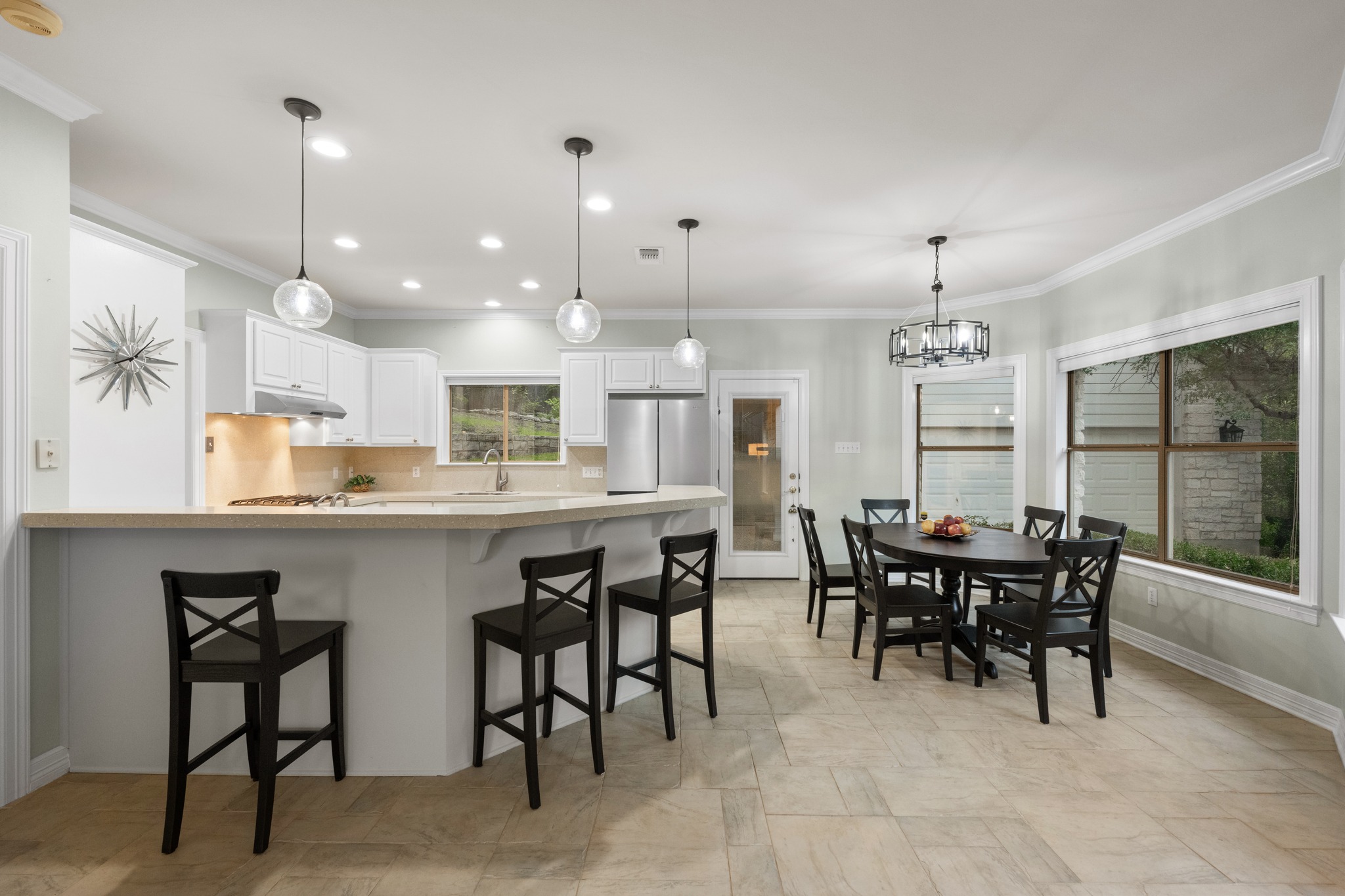 6004 Mt Bonnell Road Austin, TX 78731 - Photo 11 of 24 a large kitchen with a table and chairs