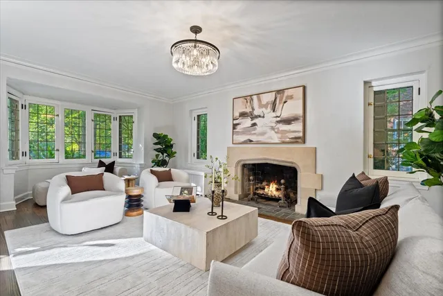 a view of a living room with furniture and wooden floor