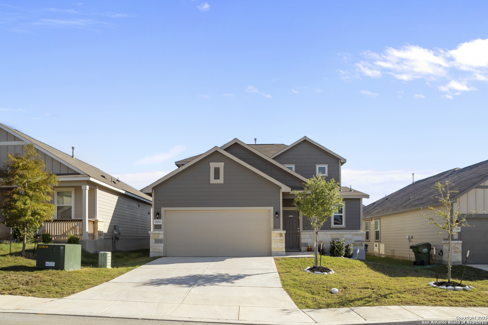 a front view of a house with a yard