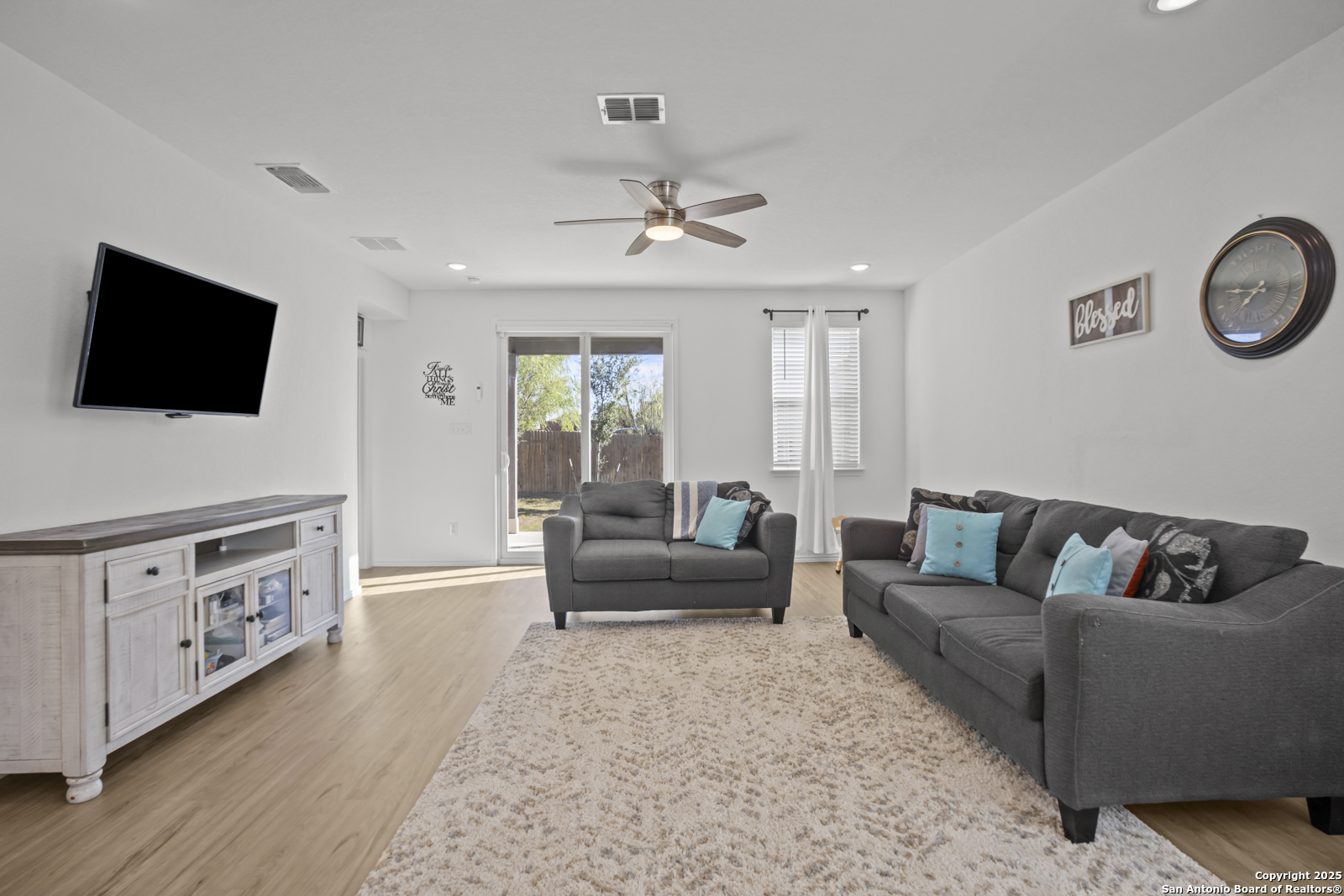 13222 Hagerd Loop St. Hedwig, TX 78152 - Photo 12 of 37 a living room with furniture and a flat screen tv