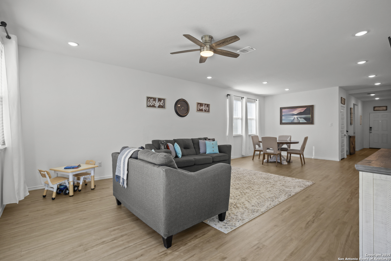 13222 Hagerd Loop St. Hedwig, TX 78152 - Photo 13 of 37 a living room with furniture and wooden floor