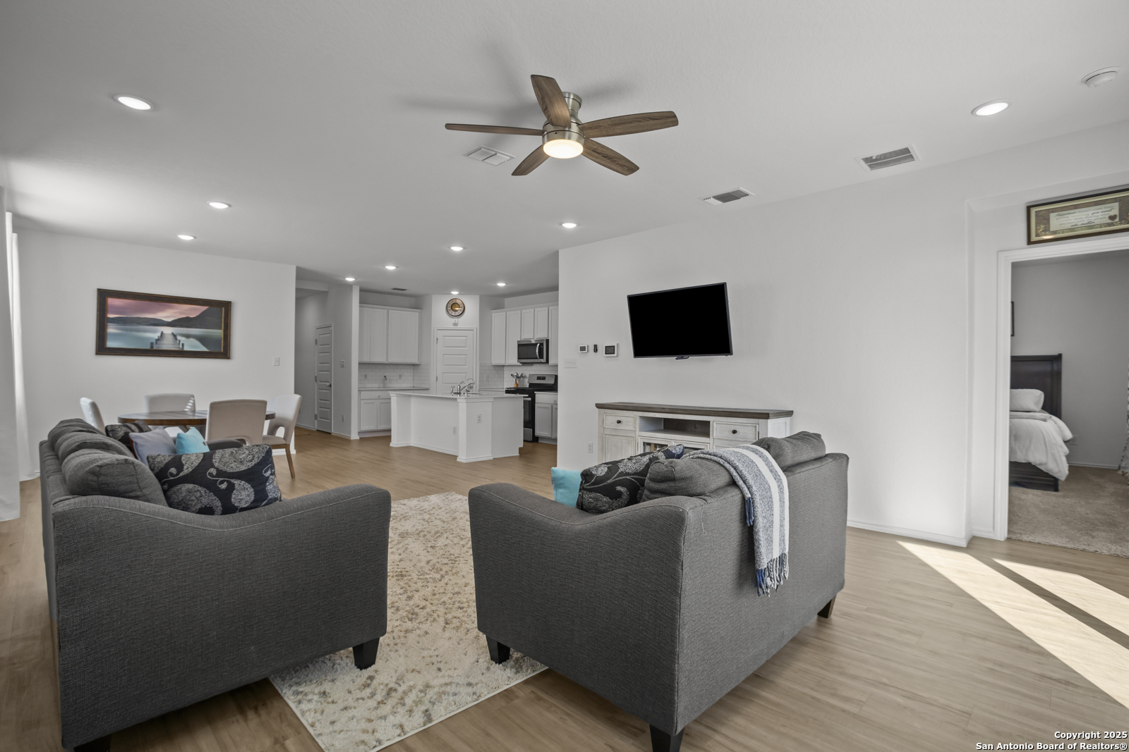 13222 Hagerd Loop St. Hedwig, TX 78152 - Photo 14 of 37 a living room with furniture and a flat screen tv