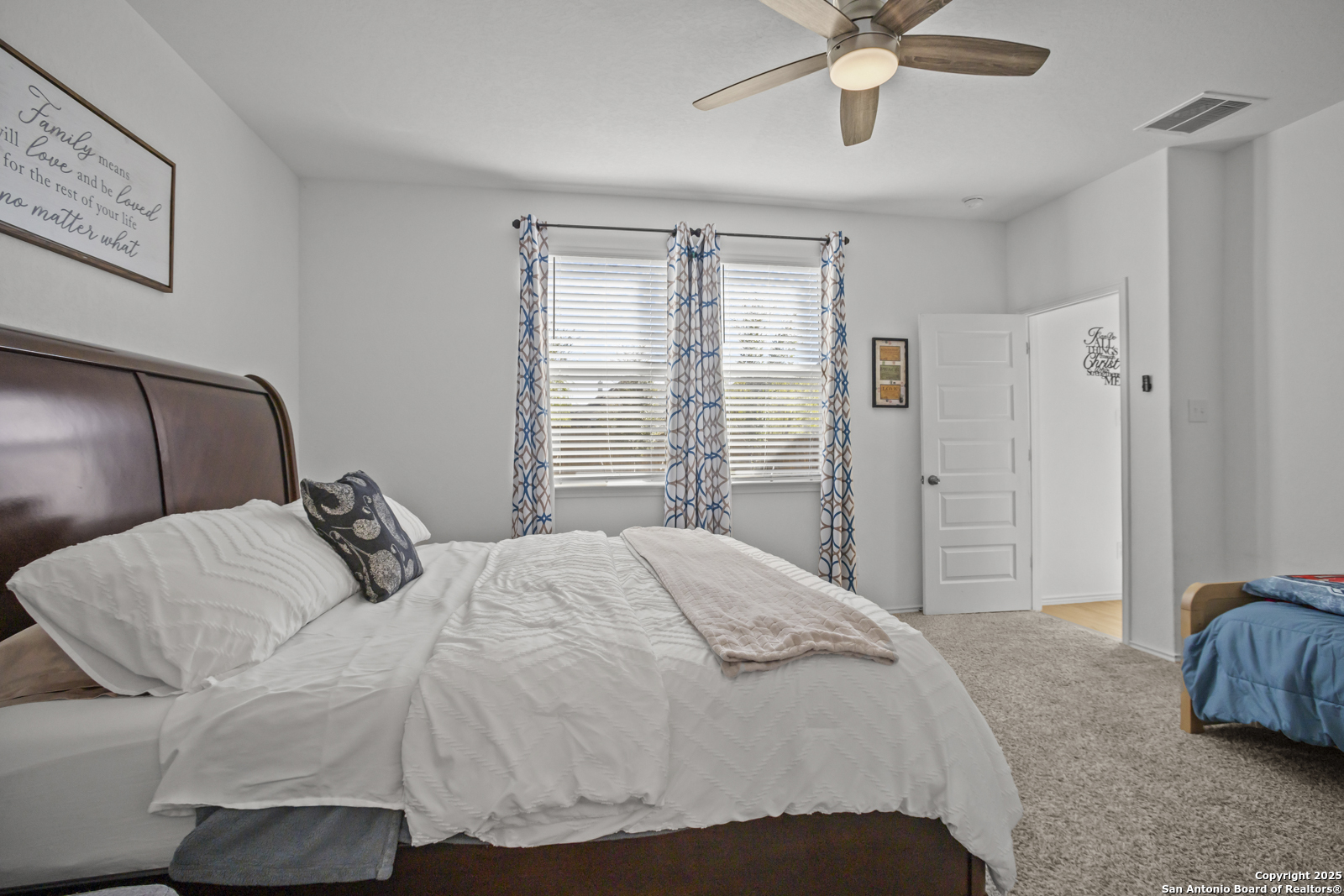 13222 Hagerd Loop St. Hedwig, TX 78152 - Photo 17 of 37 a bedroom with a bed and window
