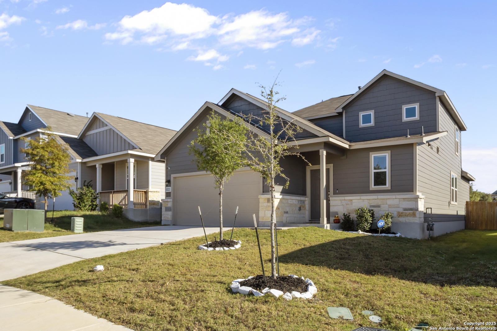 13222 Hagerd Loop St. Hedwig, TX 78152 - Photo 3 of 37 a front view of a house with garden