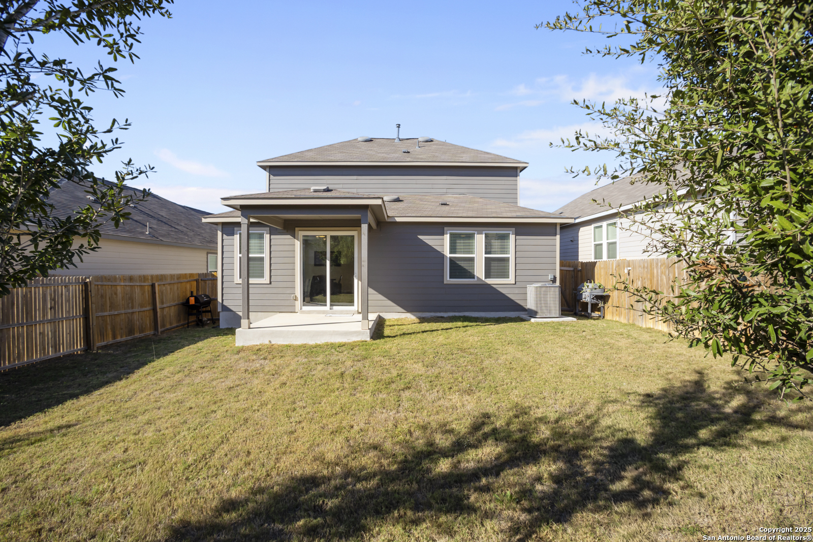 13222 Hagerd Loop St. Hedwig, TX 78152 - Photo 32 of 37 a front view of a house with a yard and garage