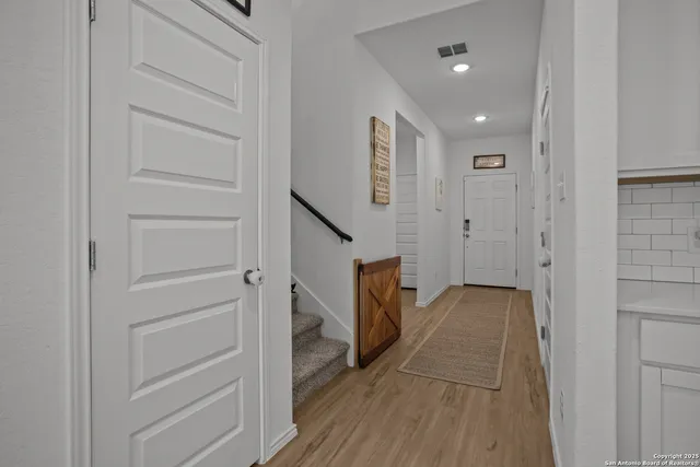 a view of a hallway with closet and entryway