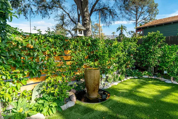 a view of a garden with a fountain