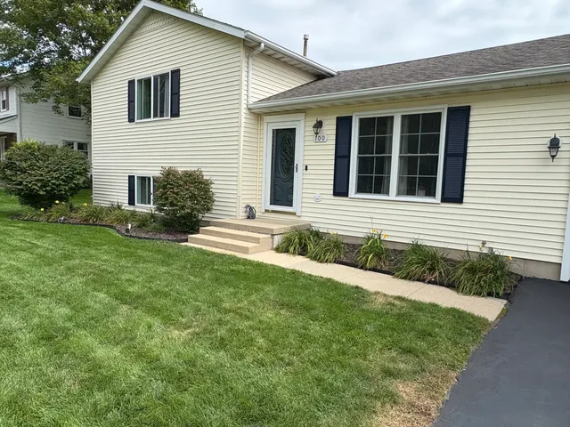 a front view of a house with a yard