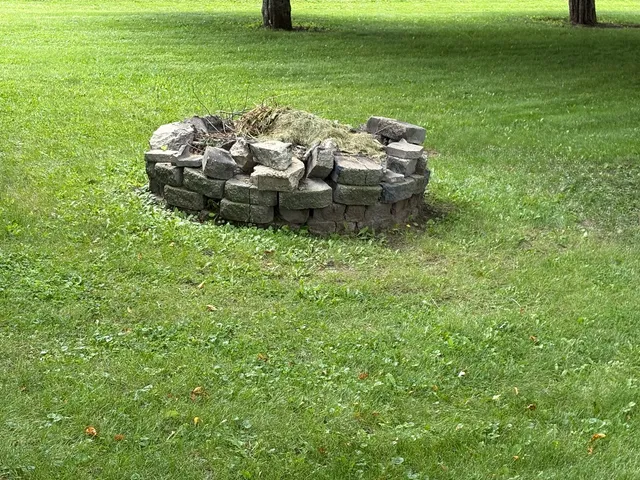 a view of a garden with lawn chairs