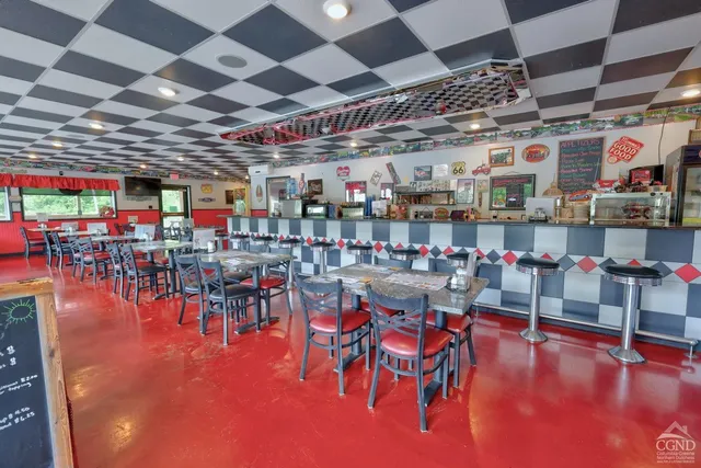 a view of a dining room with furniture window and outside view