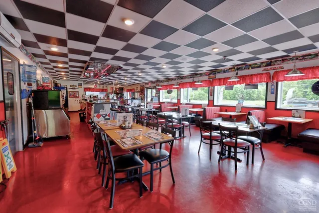a kitchen with stainless steel appliances granite countertop a stove and cabinets