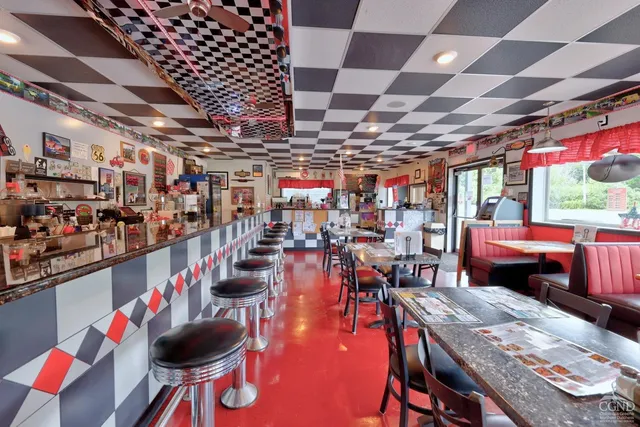 a room with furniture and a potted plant