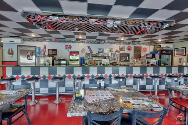 a room with furniture and a book shelf