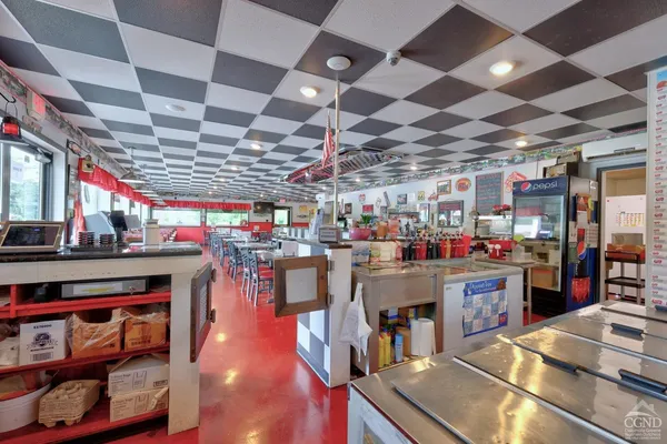 a bathroom with a sink toilet and a mirror