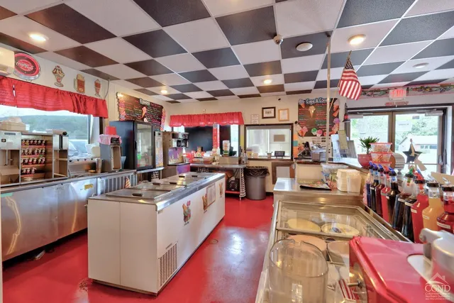 a view of a house with a garden and pathway