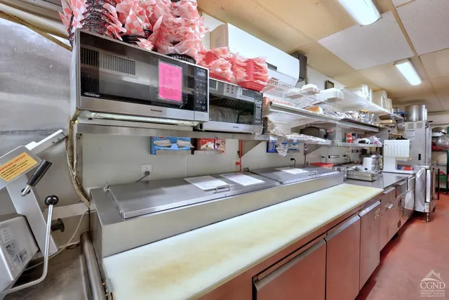 a view of a house with backyard porch and sitting area