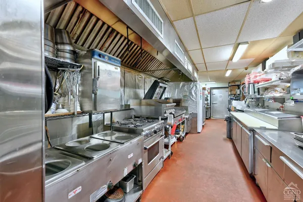 a view of a house with a yard porch and sitting area