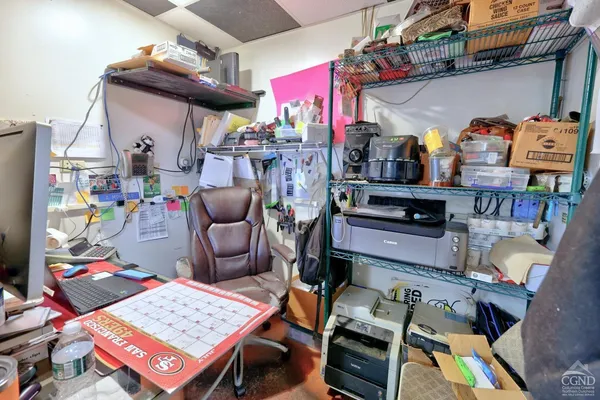 a view of a house with wooden fence and a bench