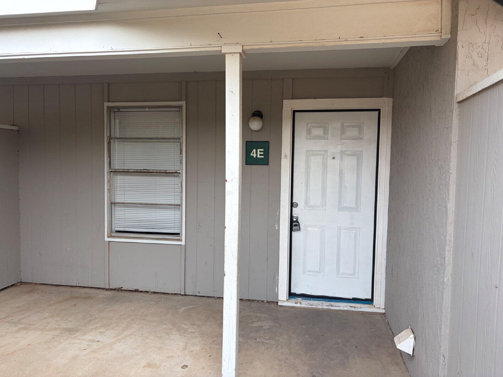 3211 35th Street, Unit E Lubbock, TX 79413 - Photo 2 of 13 a view of an empty room with closet and a window