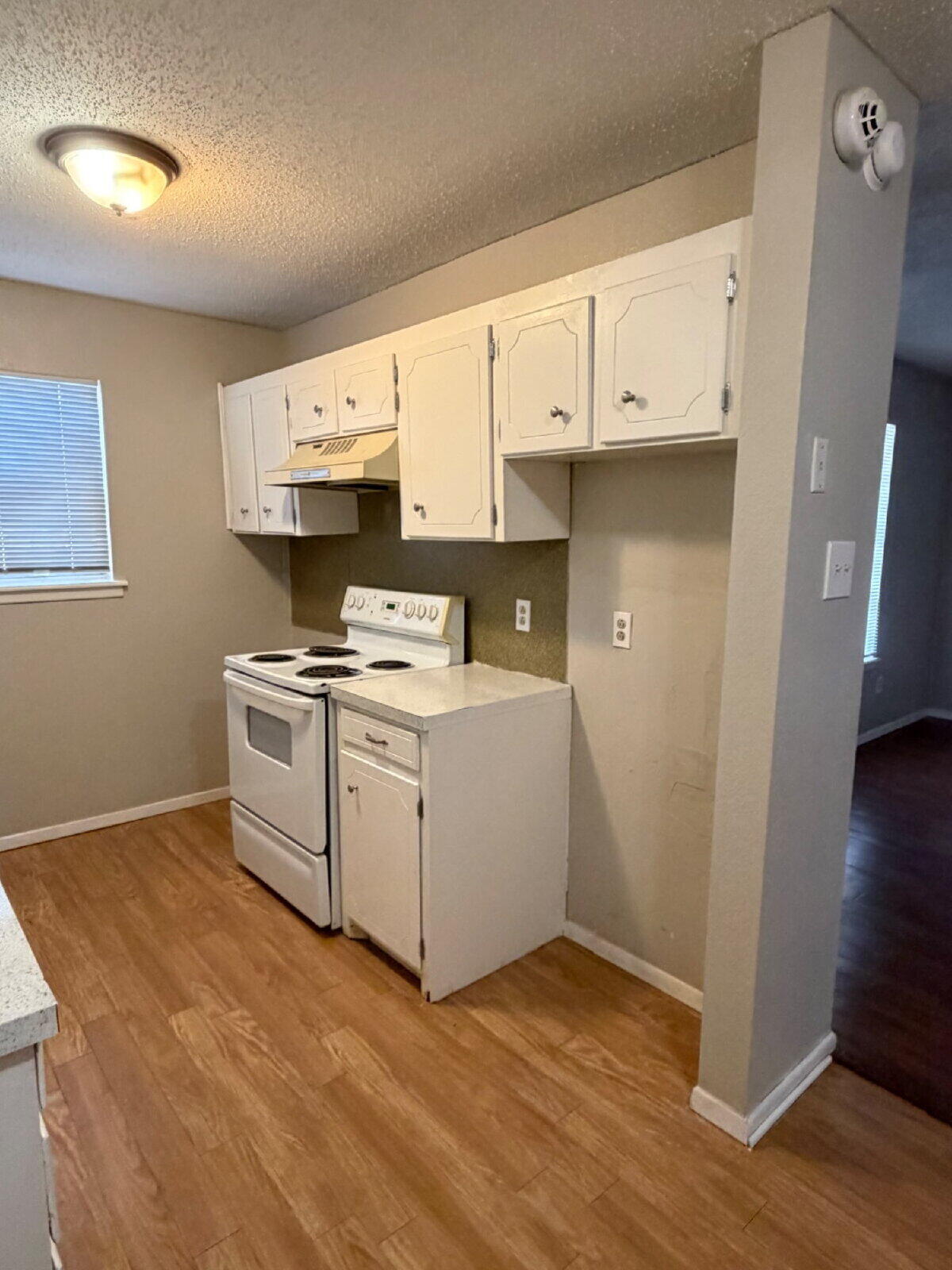 3211 35th Street, Unit E Lubbock, TX 79413 - Photo 7 of 13 a room with storage and utility