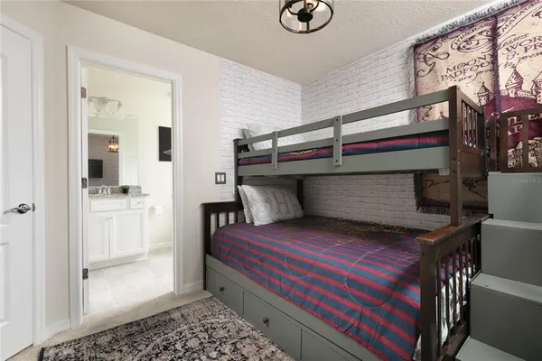 a bedroom with a bed and a table in it