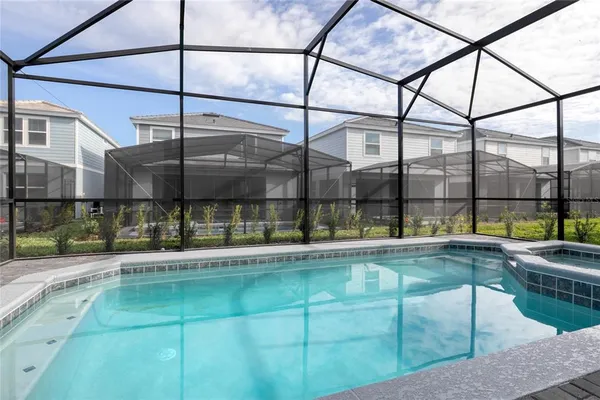 a patio with a table and chairs